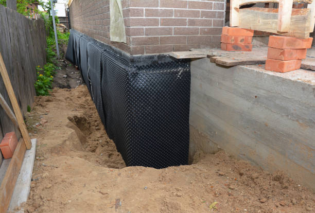 Happy homeowners after waterproofing job in Goodspring